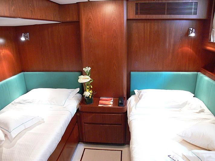 a couple of beds in a room aboard BLACK MOLLY Yacht for Sale