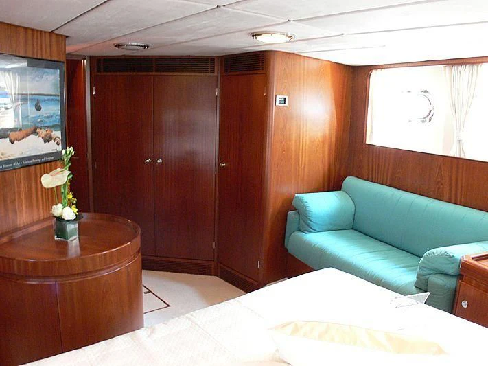 a room with a couch and a table aboard BLACK MOLLY Yacht for Sale