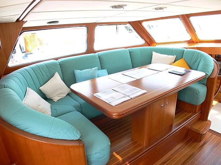 a room with a couch and a table aboard BLACK MOLLY Yacht for Sale