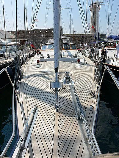 a large white boat in a harbor aboard BLACK MOLLY Yacht for Sale