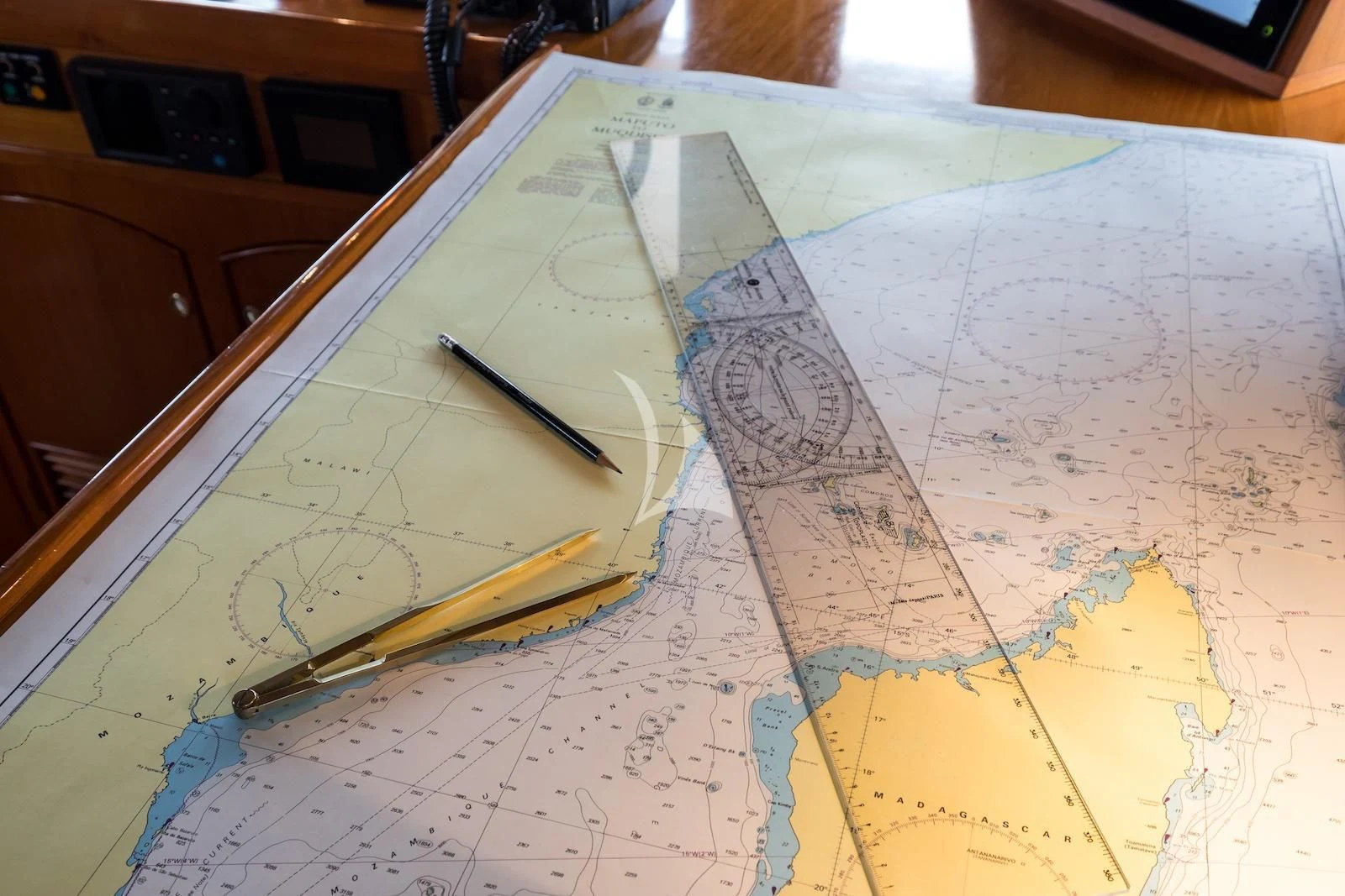 a pen on a map aboard OVER THE RAINBOW OF LONDON Yacht for Charter