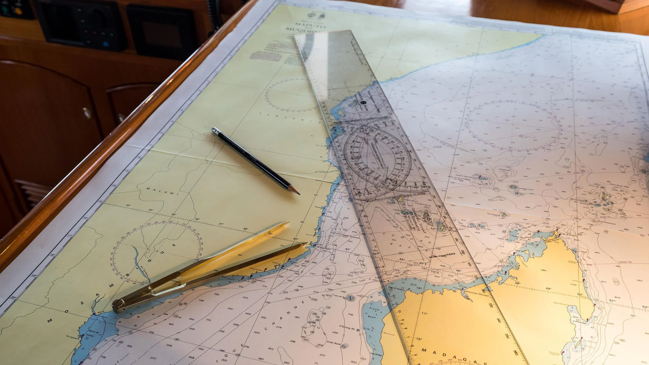 a pen on a map aboard OVER THE RAINBOW OF LONDON Yacht for Charter