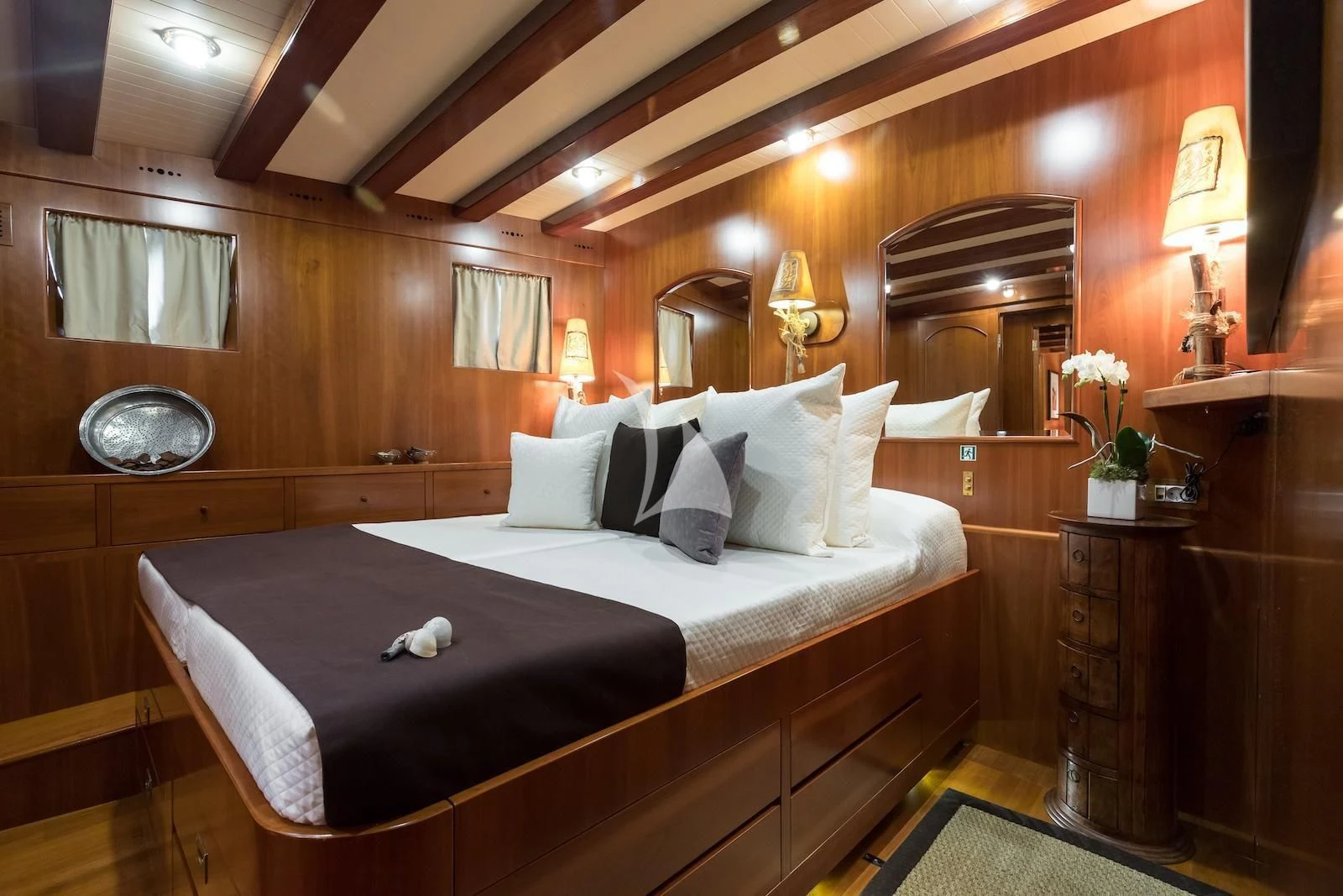 a bed in a room aboard OVER THE RAINBOW OF LONDON Yacht for Charter