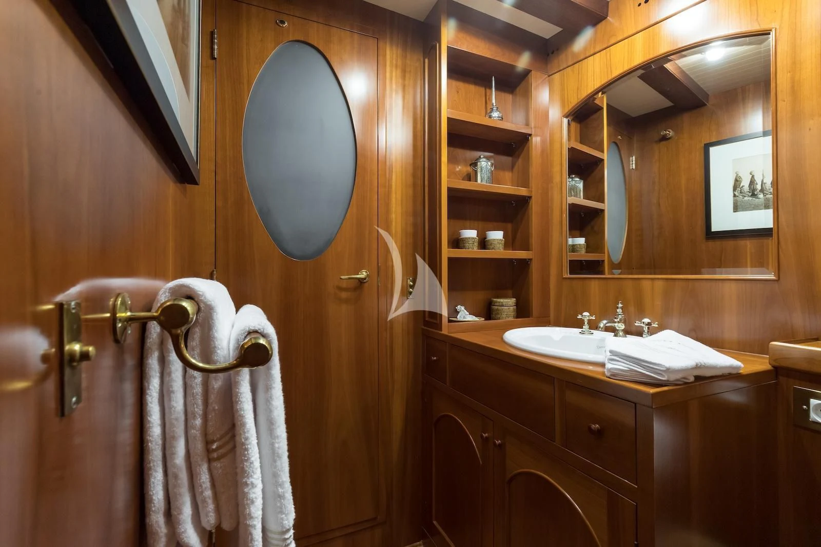 a bathroom with a large mirror aboard OVER THE RAINBOW OF LONDON Yacht for Charter