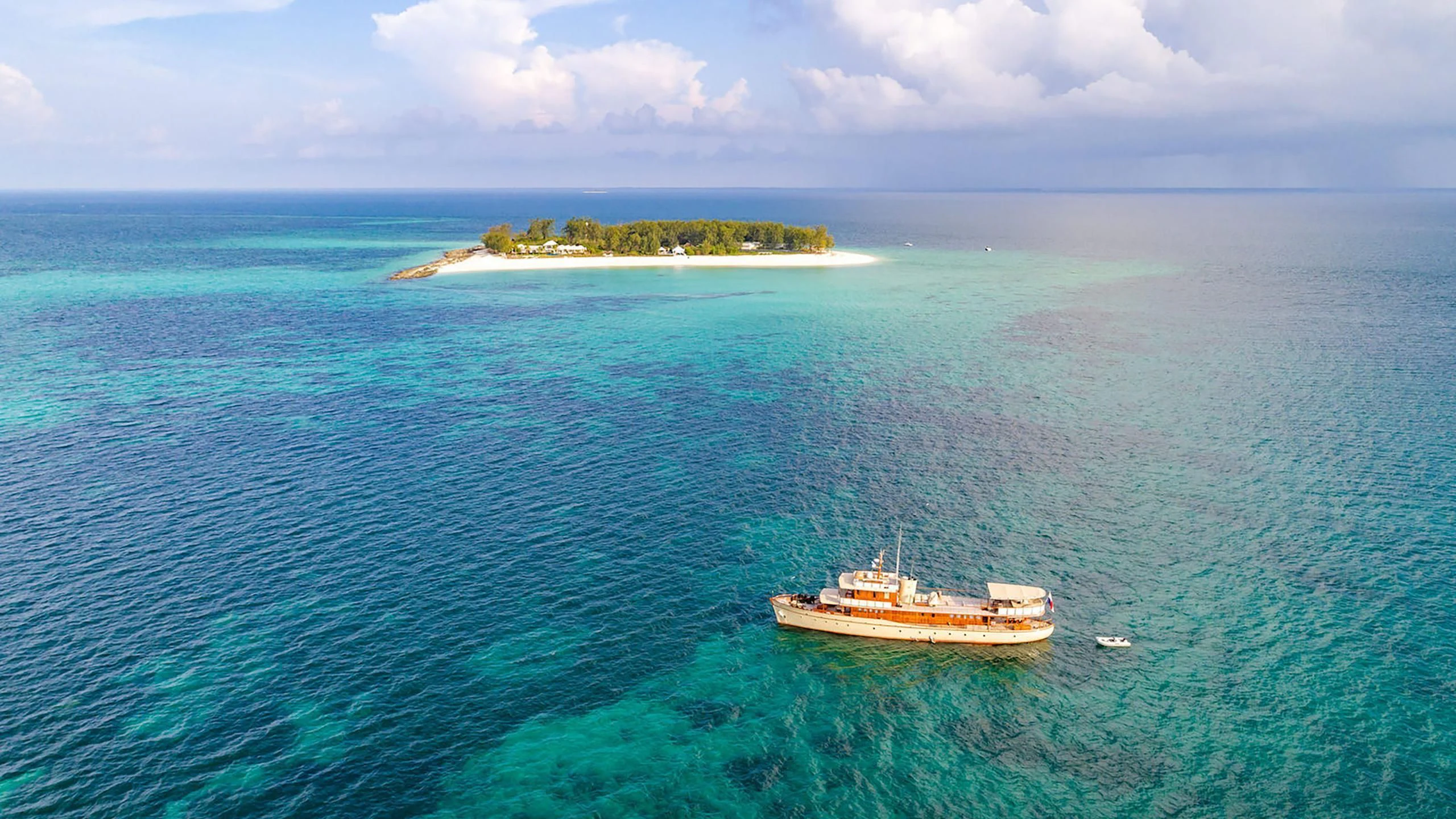 a small island in the middle of the ocean aboard OVER THE RAINBOW OF LONDON Yacht for Charter