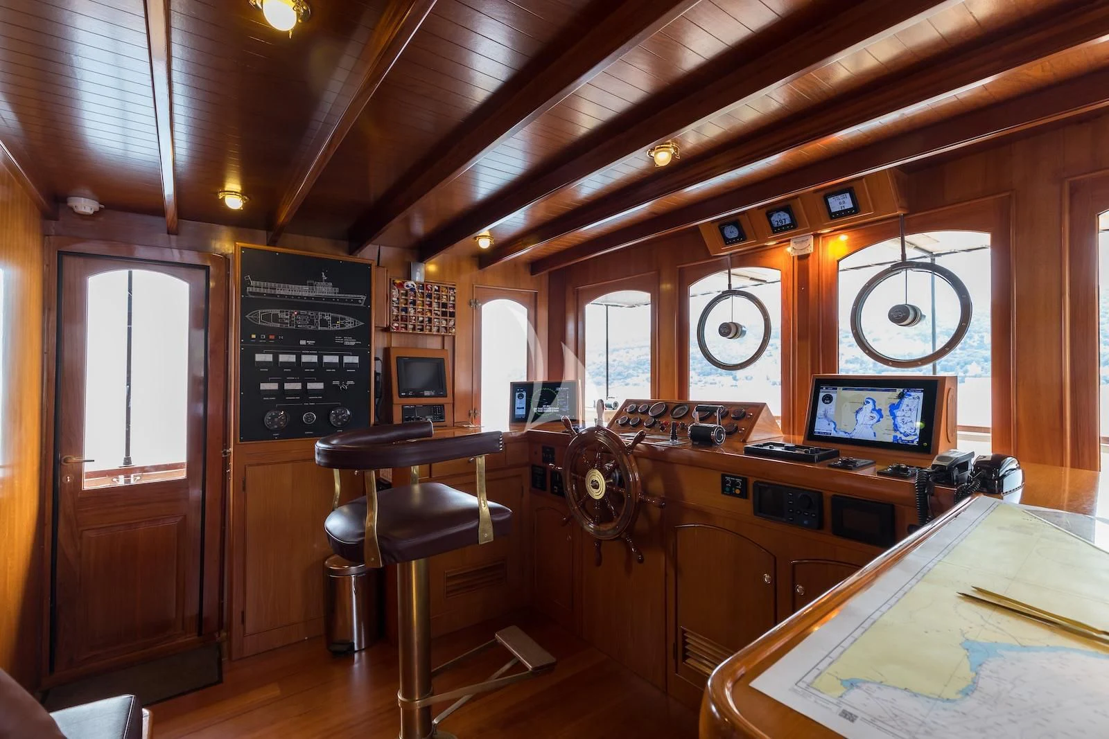 a room with a desk and chairs aboard OVER THE RAINBOW OF LONDON Yacht for Charter