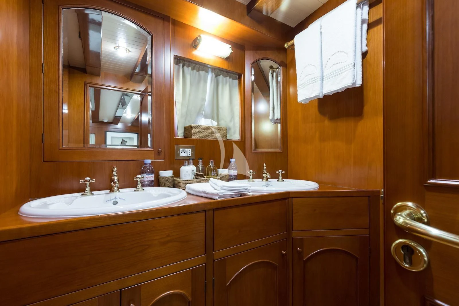 a bathroom with a large mirror aboard OVER THE RAINBOW OF LONDON Yacht for Charter