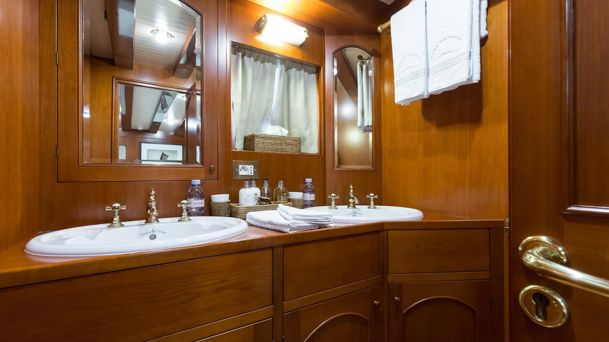 a bathroom with a large mirror aboard OVER THE RAINBOW OF LONDON Yacht for Charter