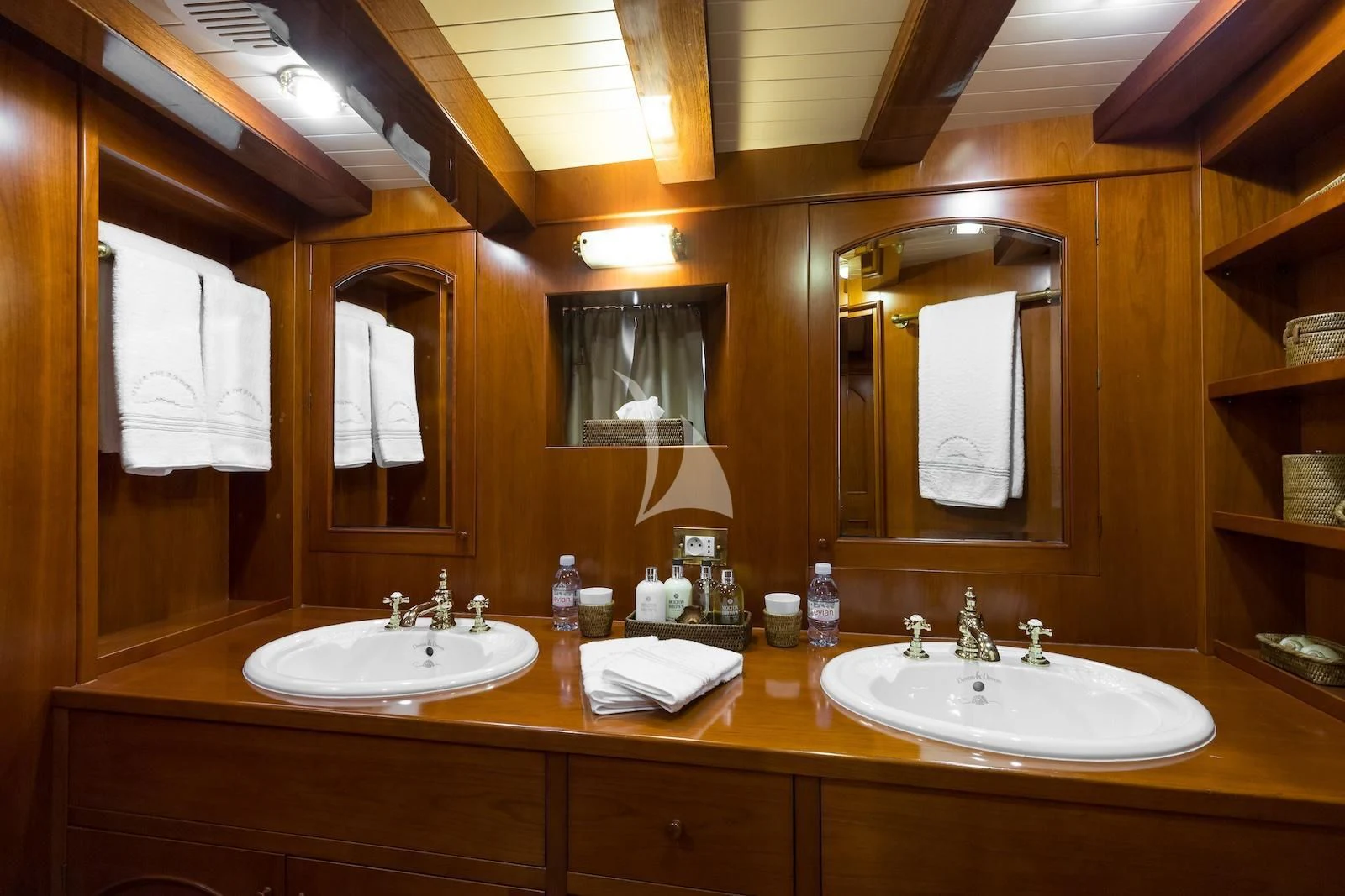 a bathroom with two sinks and mirrors aboard OVER THE RAINBOW OF LONDON Yacht for Charter