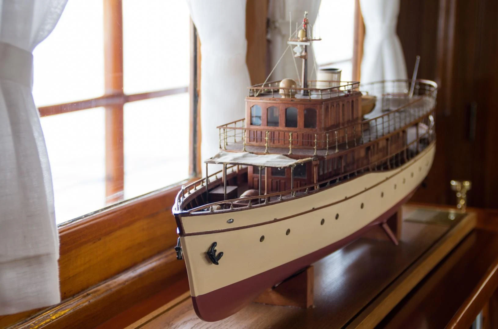 a wooden model ship aboard OVER THE RAINBOW OF LONDON Yacht for Charter