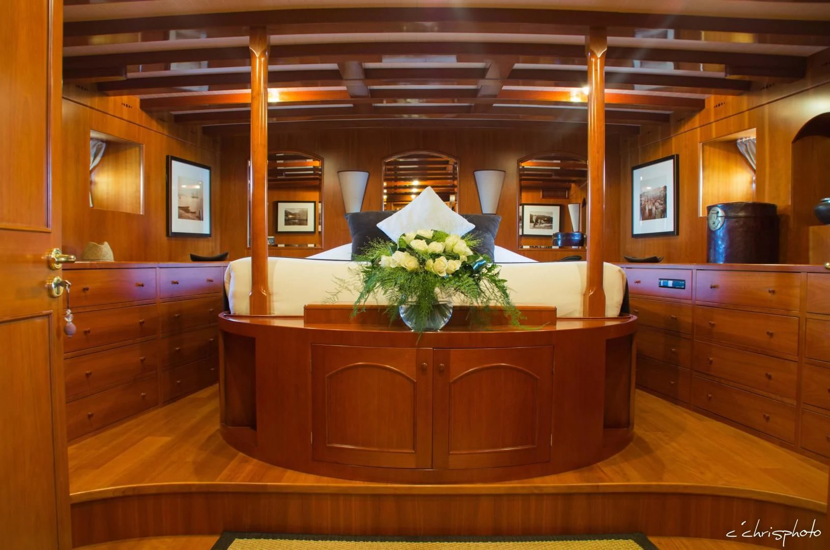 a wooden cabinet with a plant in it aboard OVER THE RAINBOW OF LONDON Yacht for Charter