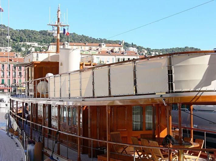 a building with a large structure on top aboard OVER THE RAINBOW OF LONDON Yacht for Charter