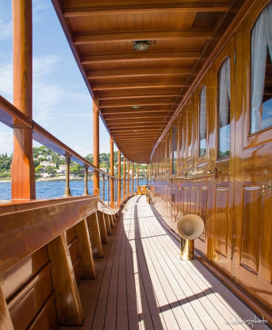 a wooden walkway over water aboard OVER THE RAINBOW OF LONDON Yacht for Charter