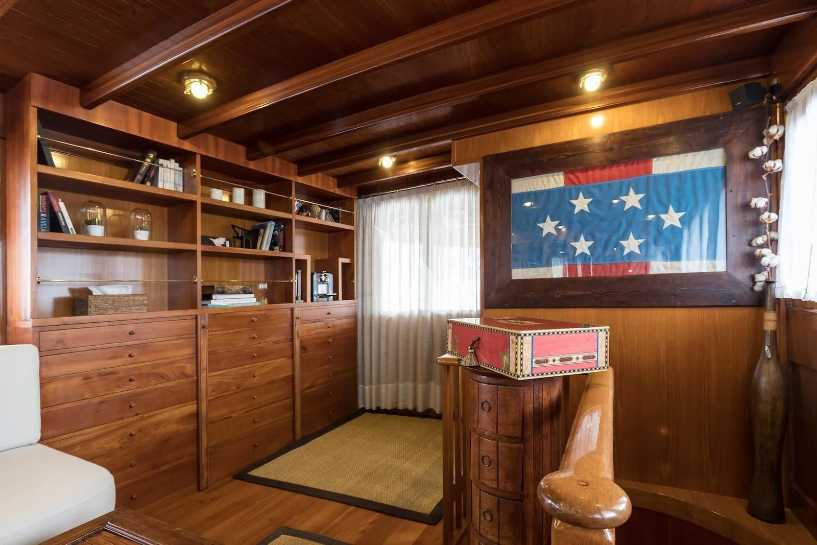 a room with a desk and a television aboard OVER THE RAINBOW OF LONDON Yacht for Charter