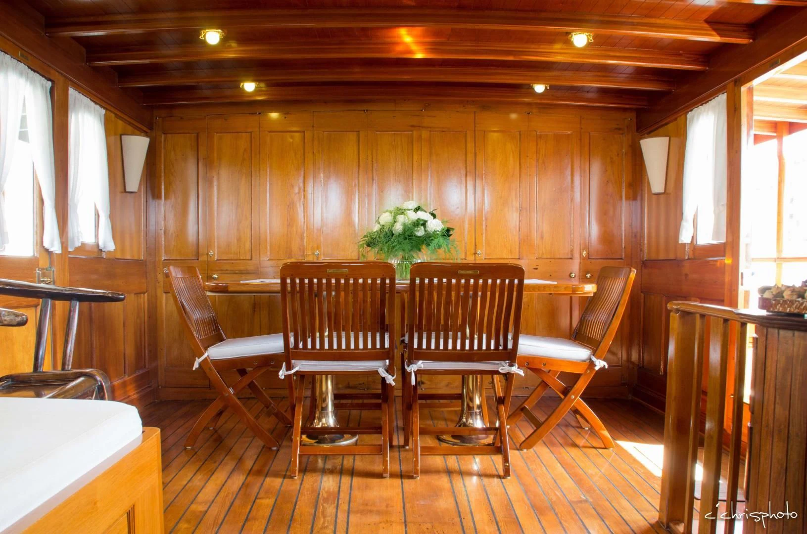 a room with chairs and tables aboard OVER THE RAINBOW OF LONDON Yacht for Charter