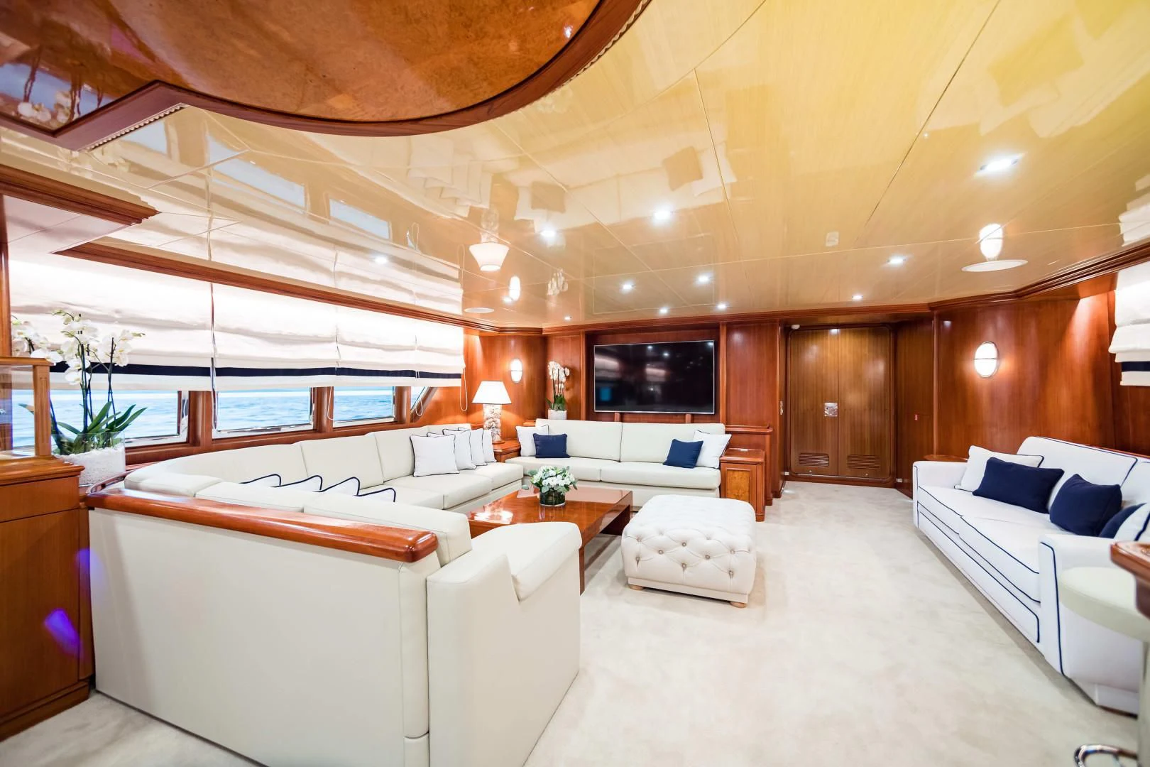 a large living room with a large open ceiling aboard WIND OF FORTUNE Yacht for Charter