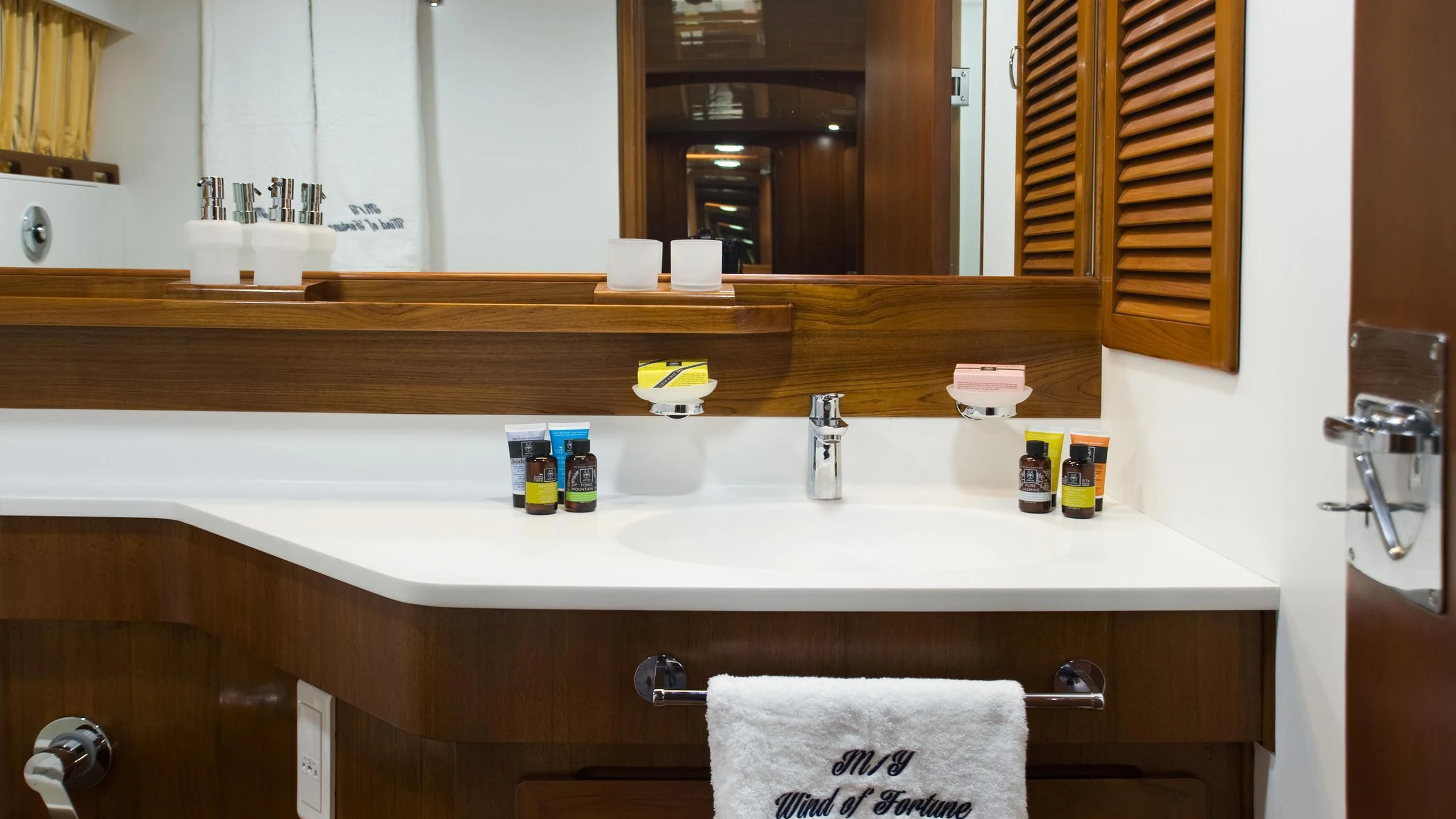 a bathroom with a sink and a towel aboard WIND OF FORTUNE Yacht for Charter