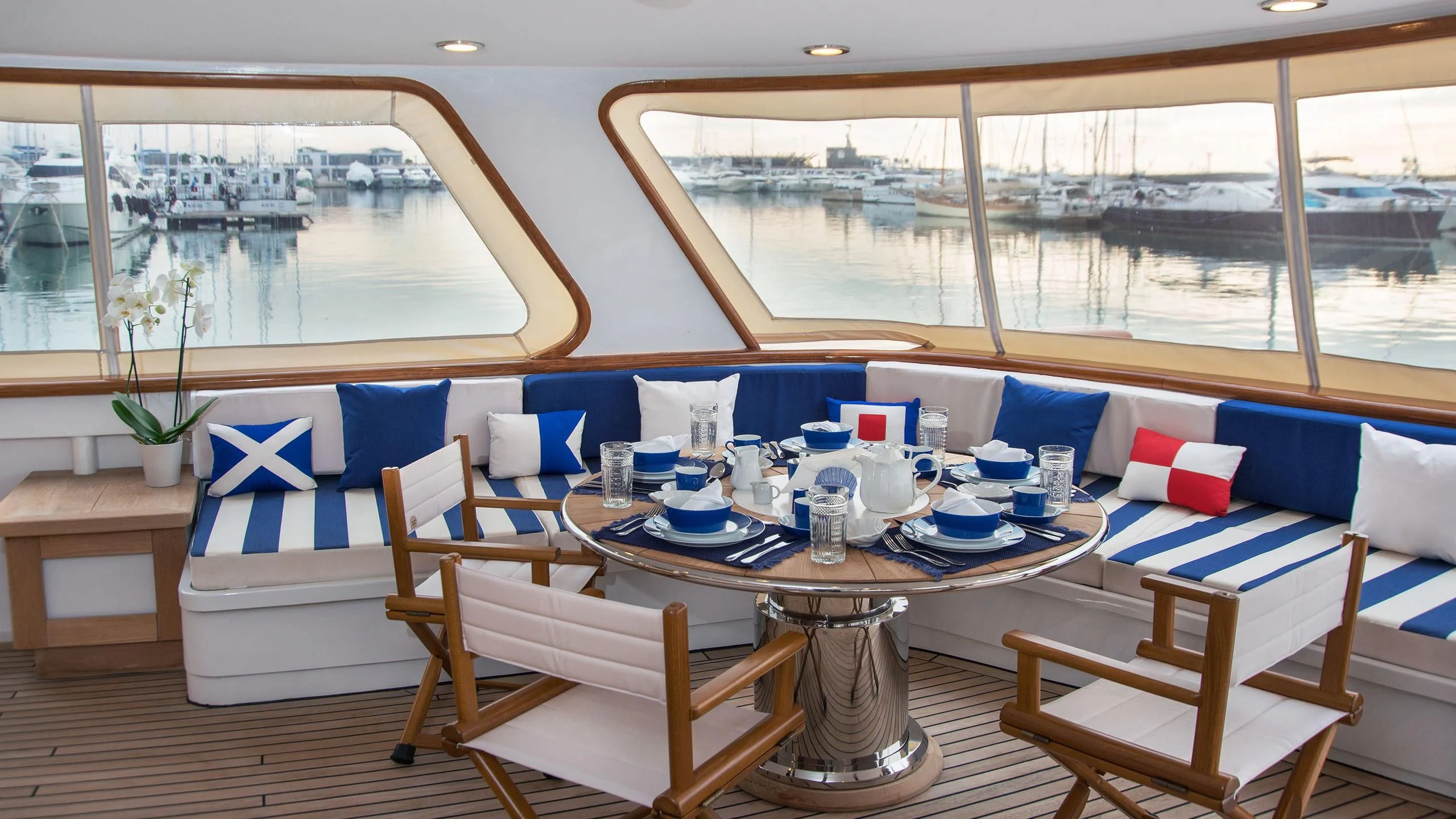 a table with chairs and a table aboard WIND OF FORTUNE Yacht for Charter