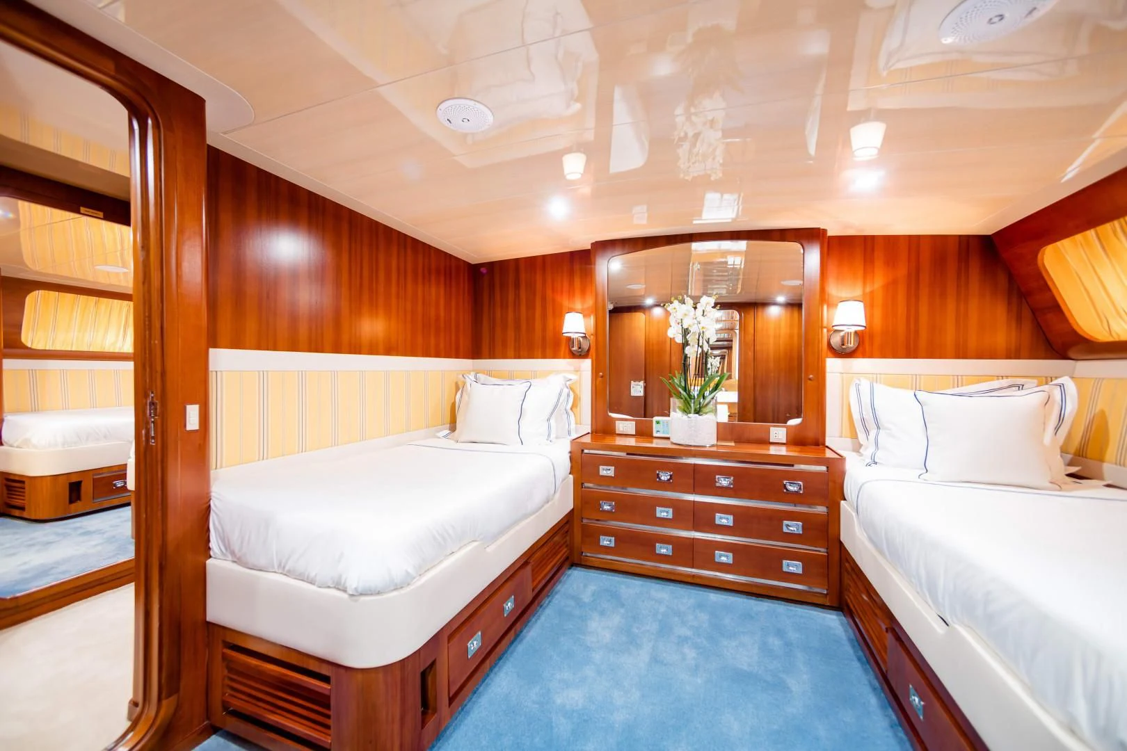 a room with a couple of beds aboard WIND OF FORTUNE Yacht for Charter
