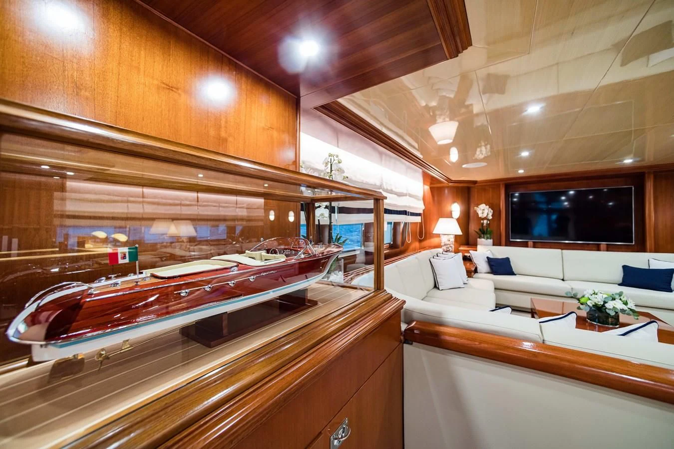 a room with a bed and a television aboard WIND OF FORTUNE Yacht for Charter