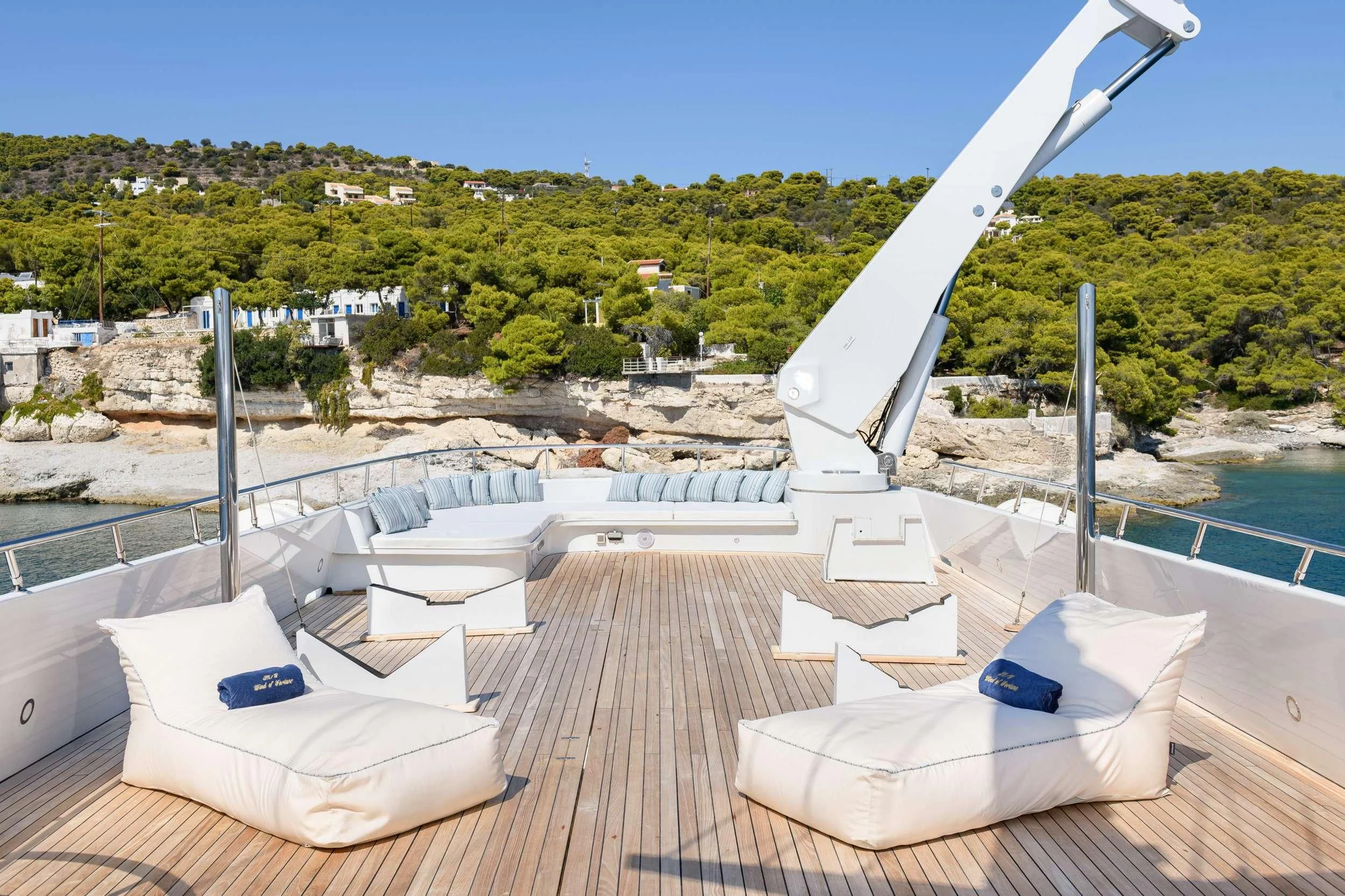 a deck with chairs and a slide on it aboard WIND OF FORTUNE Yacht for Charter