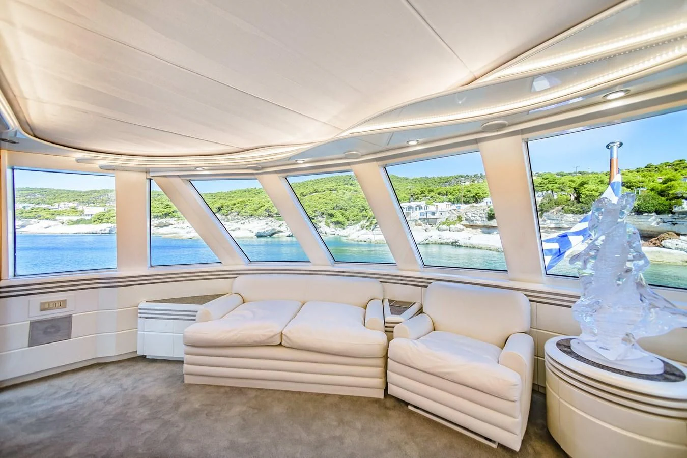 a room with a bed and a fountain aboard WIND OF FORTUNE Yacht for Charter