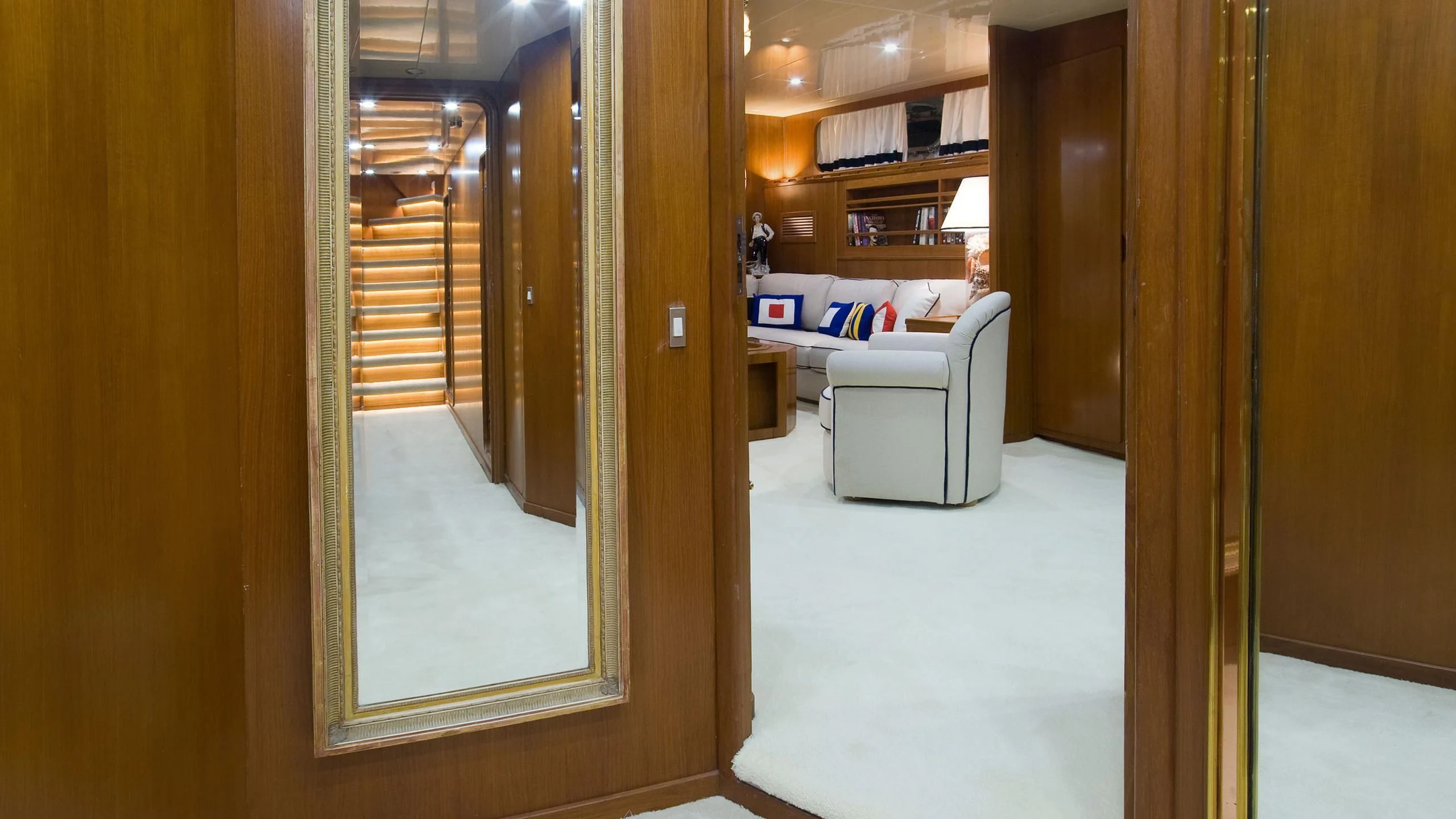 a room with a couch and a door aboard WIND OF FORTUNE Yacht for Charter
