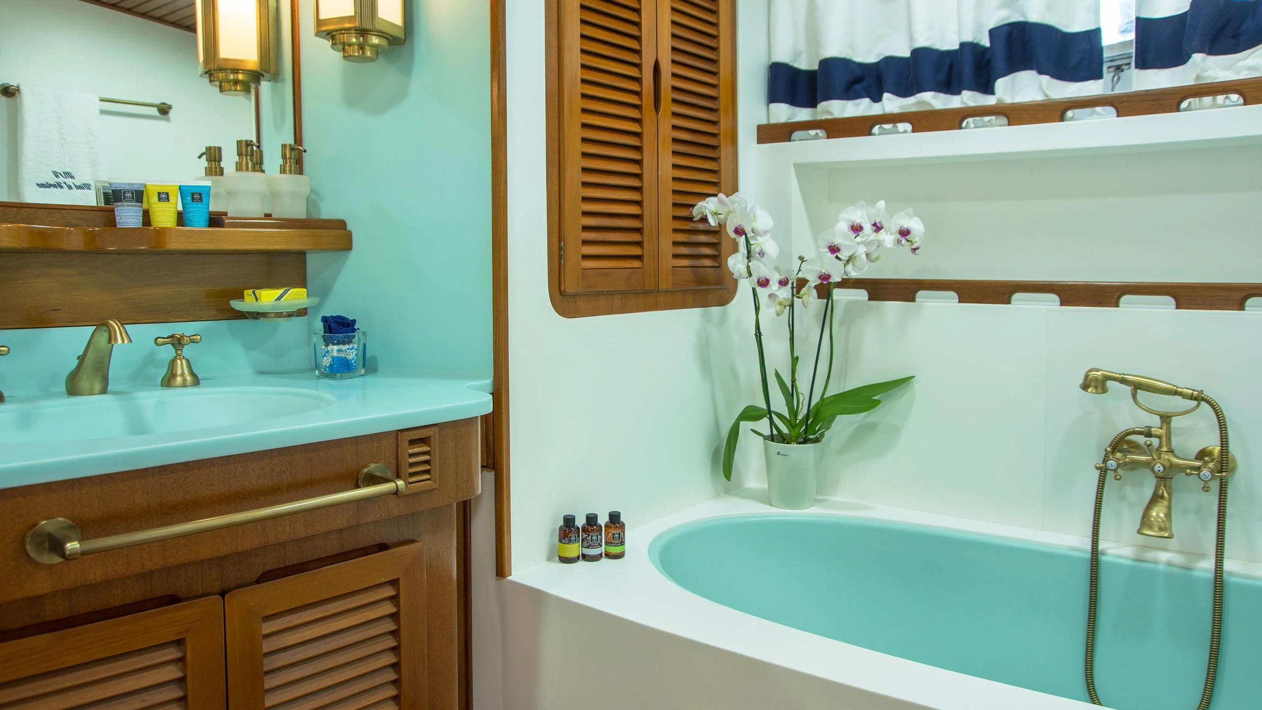 a bathroom with a flower vase aboard WIND OF FORTUNE Yacht for Charter