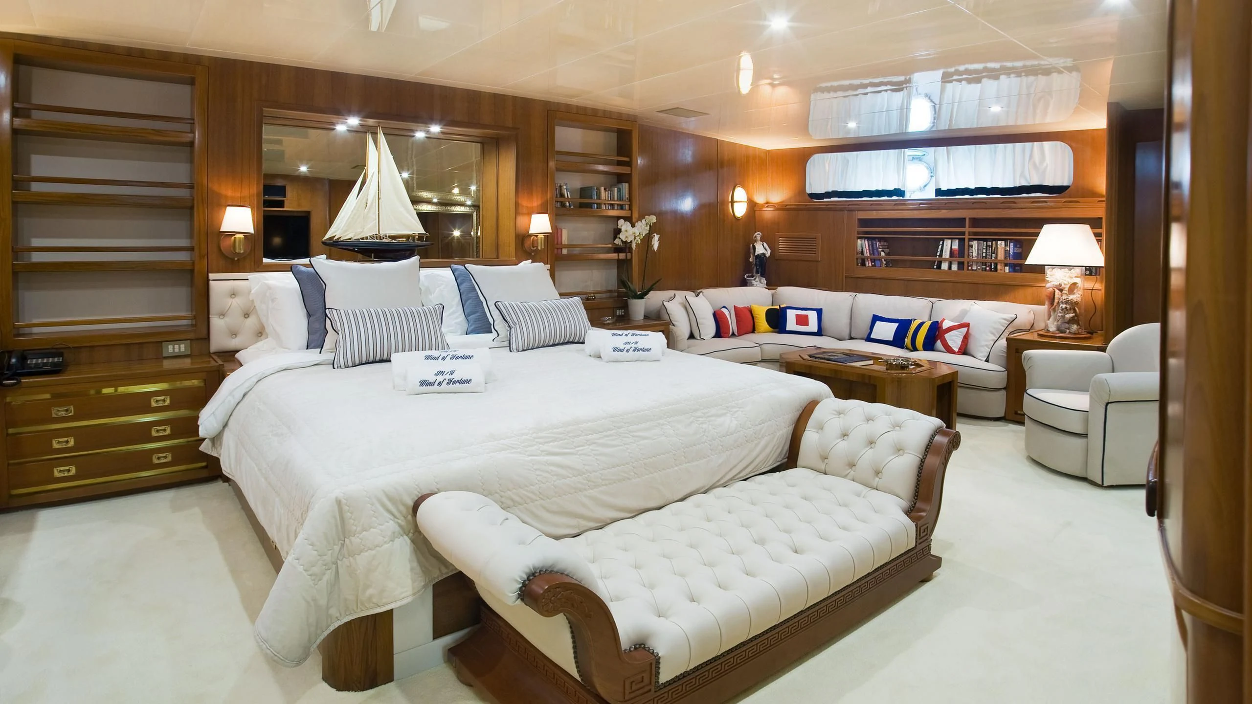 a large bed in a room aboard WIND OF FORTUNE Yacht for Charter