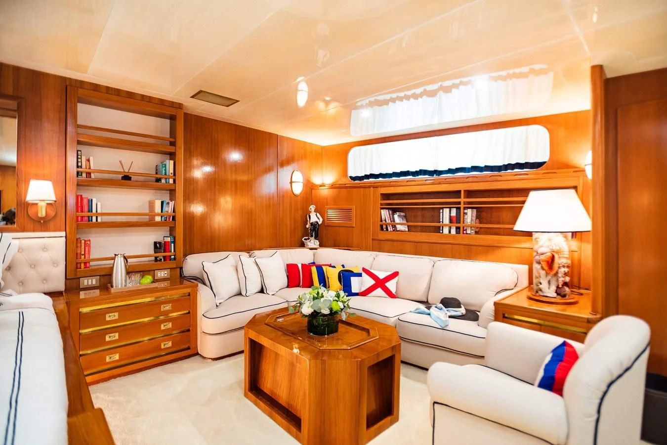 a living room with a couch and a coffee table aboard WIND OF FORTUNE Yacht for Charter
