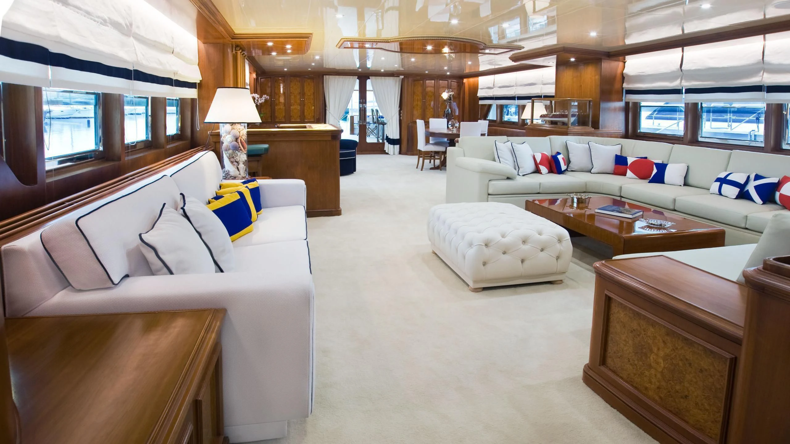 a room with a couch and a table aboard WIND OF FORTUNE Yacht for Charter
