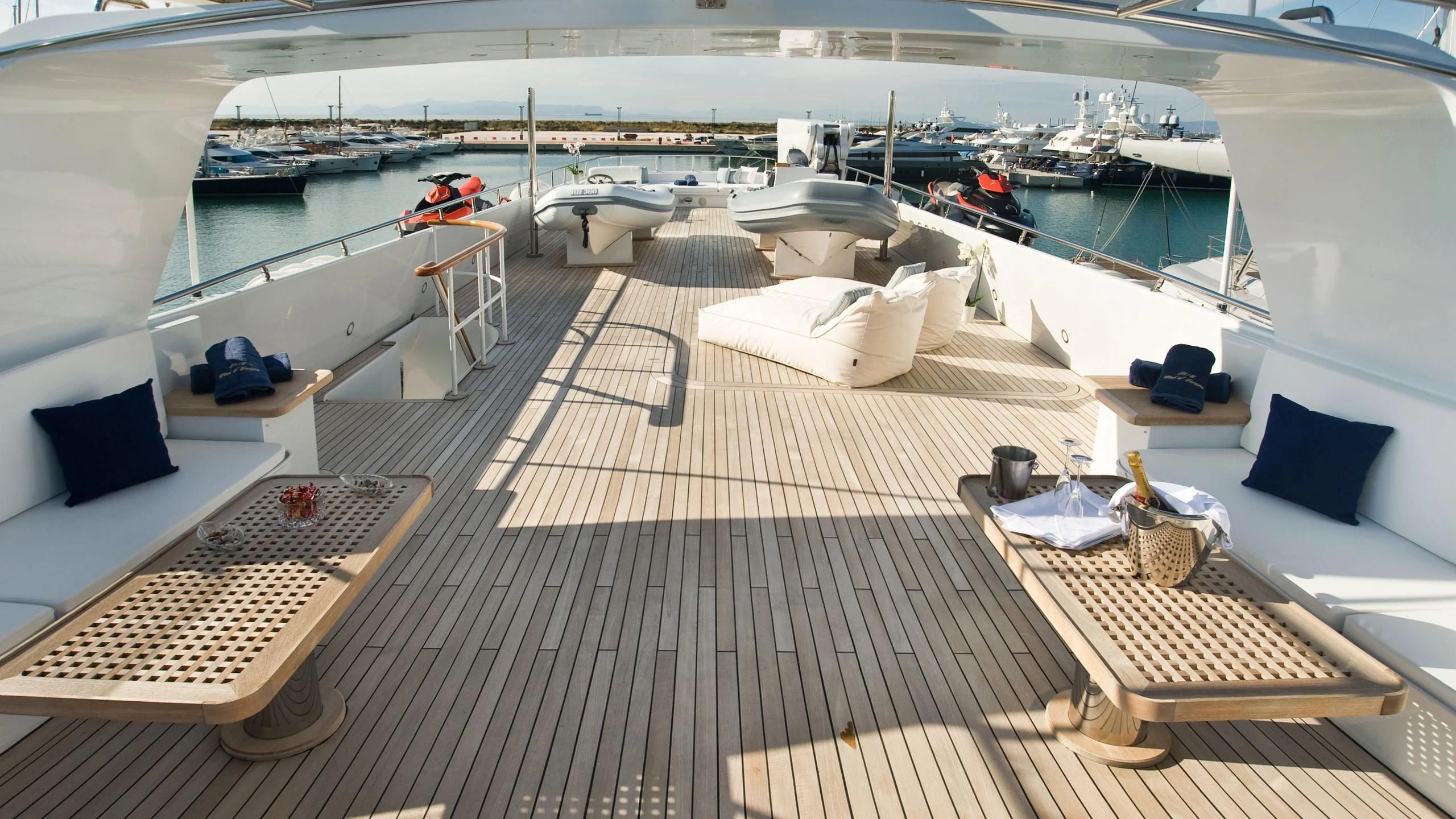 a deck with a deck and boats aboard WIND OF FORTUNE Yacht for Charter