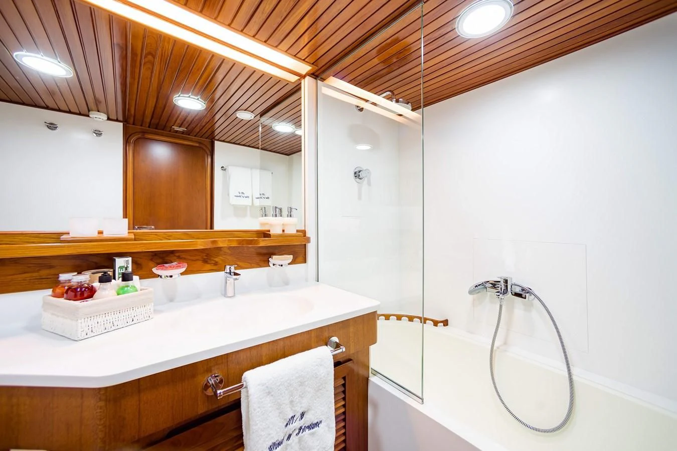 a bathroom with a large mirror aboard WIND OF FORTUNE Yacht for Charter