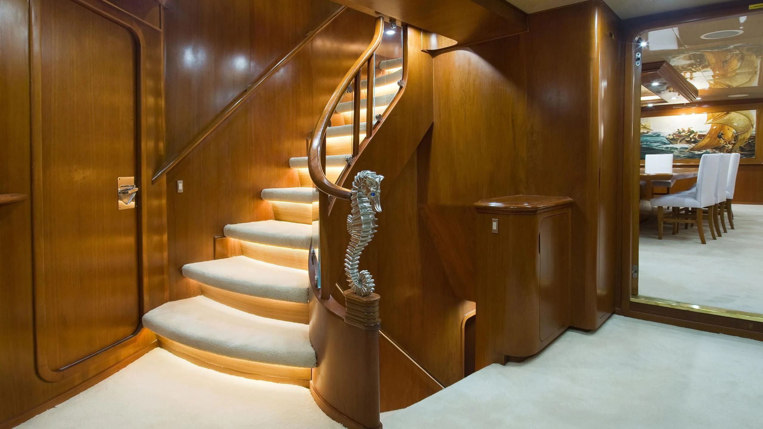 a staircase with wood railings aboard WIND OF FORTUNE Yacht for Charter