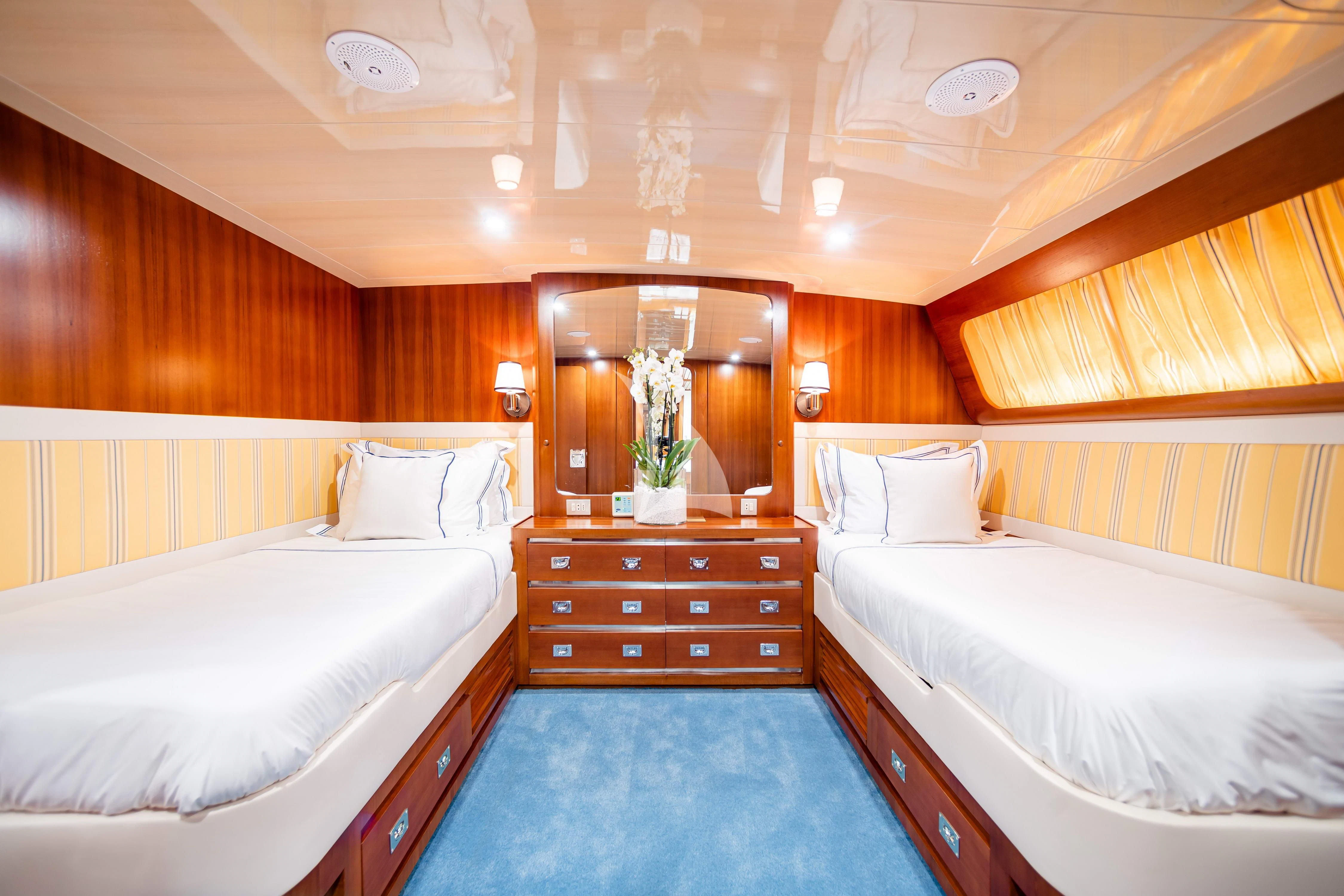 a room with two beds aboard WIND OF FORTUNE Yacht for Charter