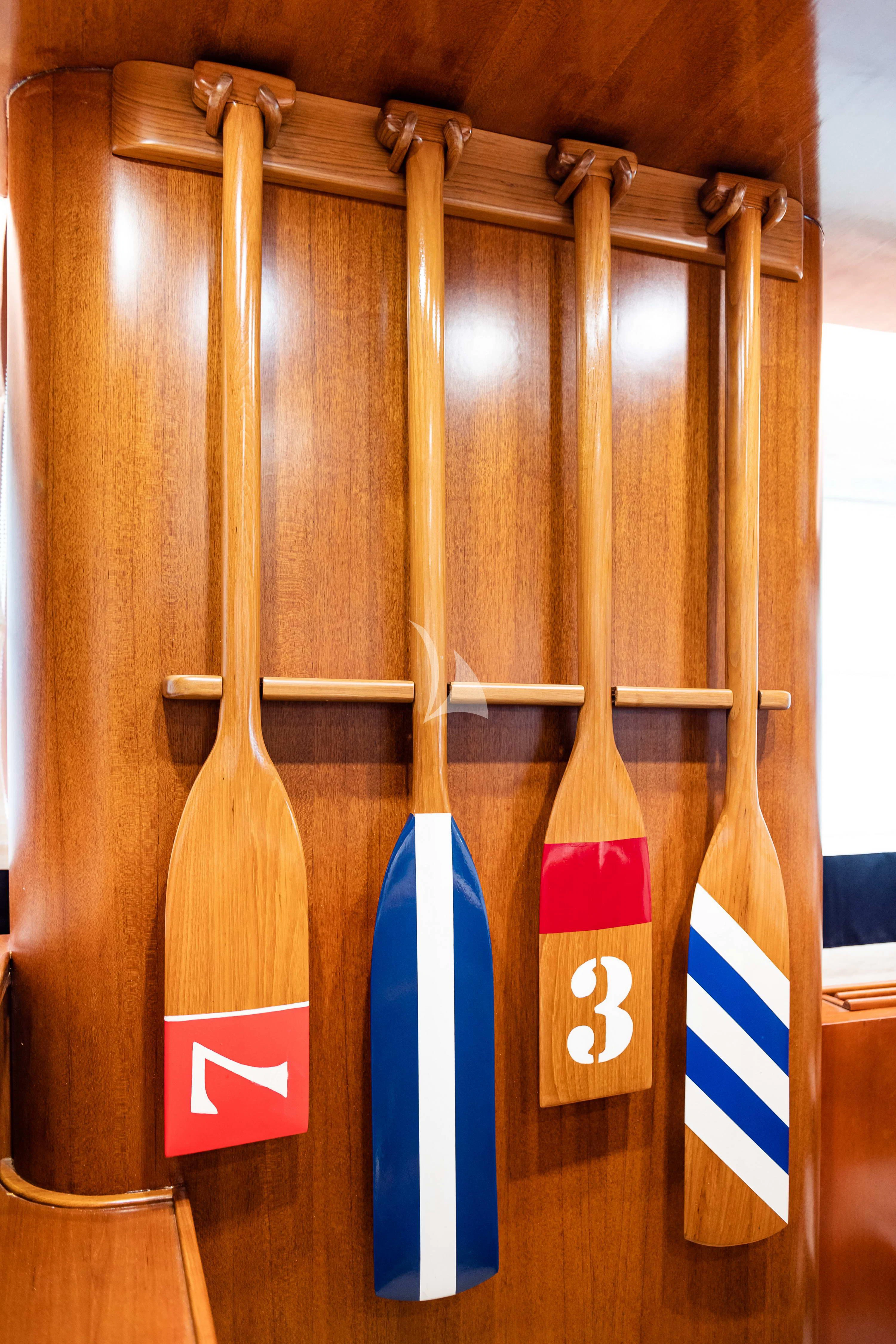 a wood rack with a few flags on it aboard WIND OF FORTUNE Yacht for Charter
