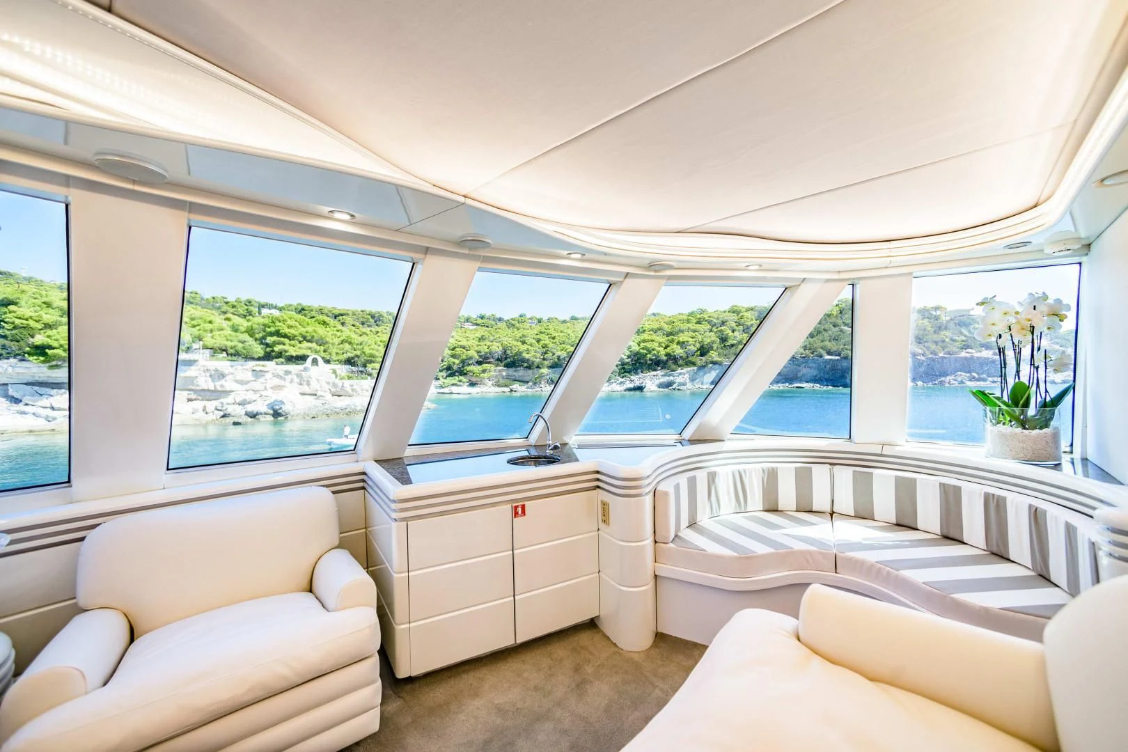 a room with a bed and a desk aboard WIND OF FORTUNE Yacht for Charter