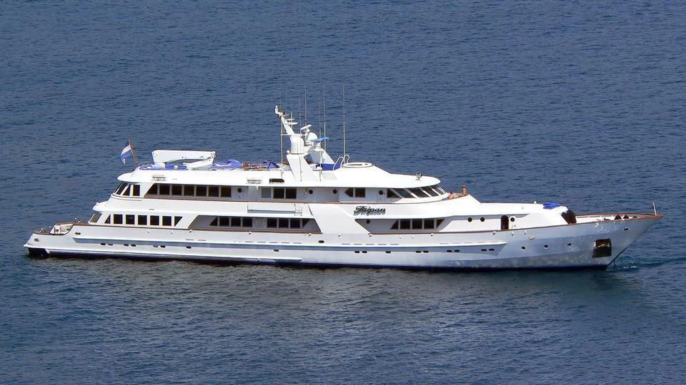 a white boat in the water aboard WIND OF FORTUNE Yacht for Charter