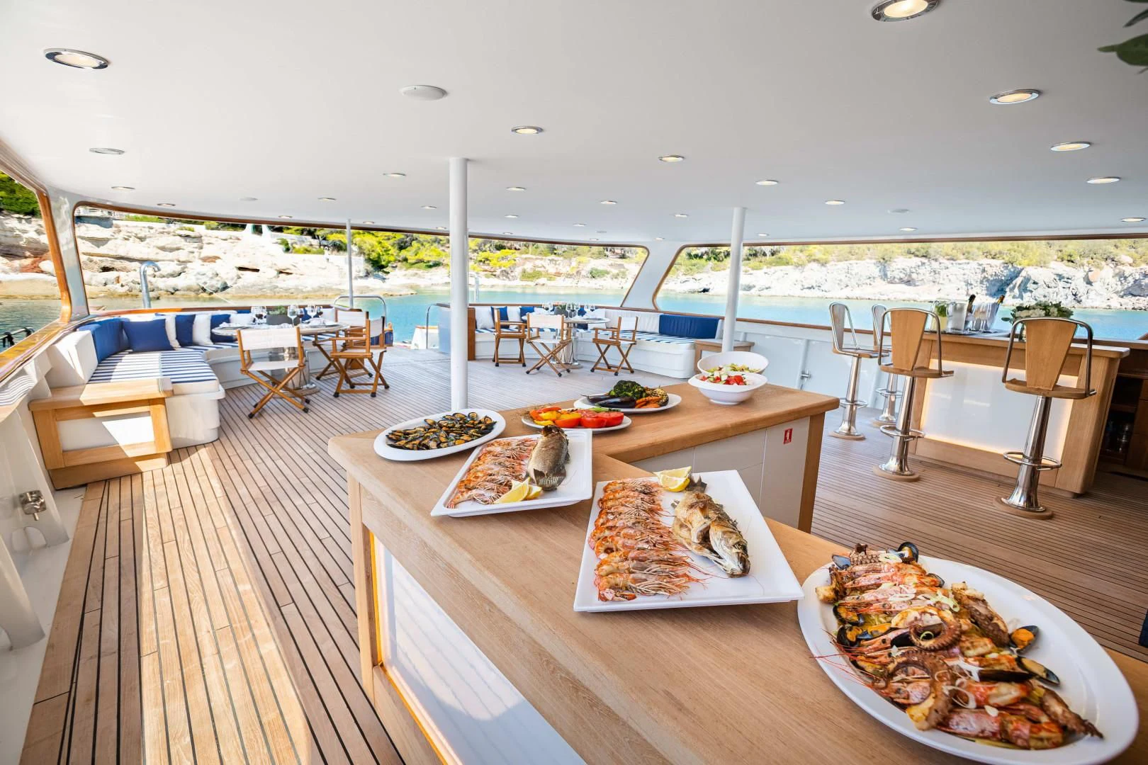 a table with pizzas on it aboard WIND OF FORTUNE Yacht for Charter