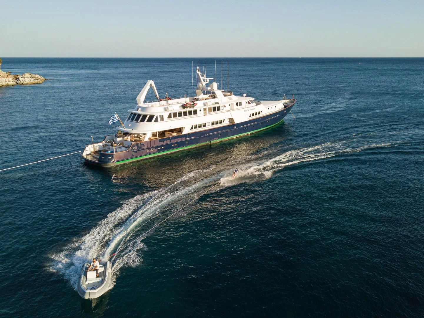 a large ship on the water aboard WIND OF FORTUNE Yacht for Charter