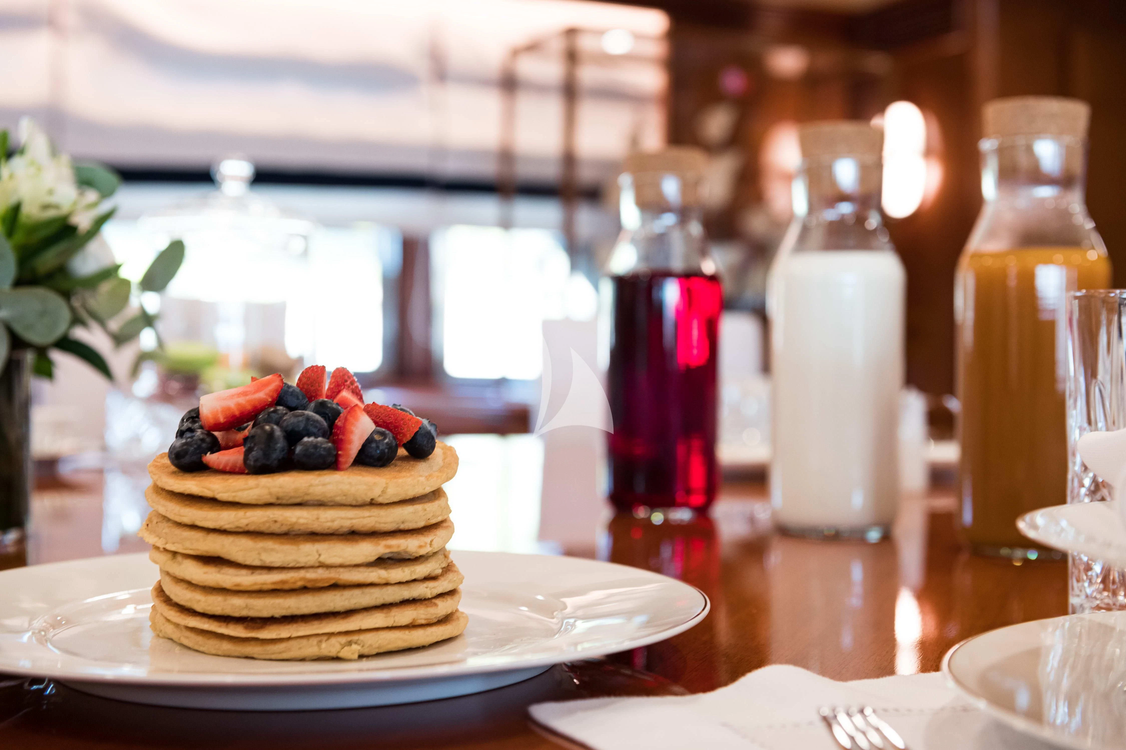 a cake on a plate aboard WIND OF FORTUNE Yacht for Charter
