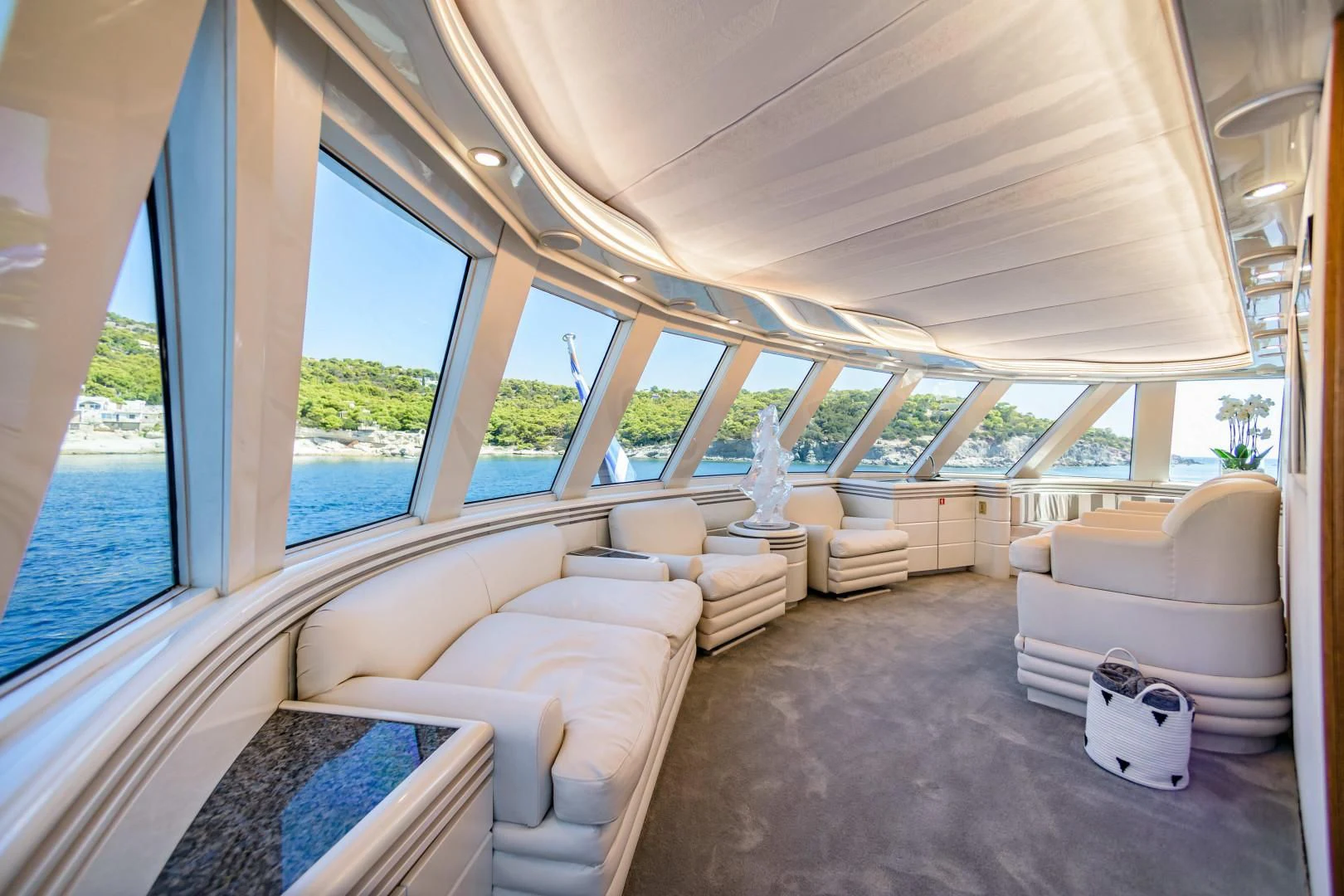 a room with a large window aboard WIND OF FORTUNE Yacht for Charter