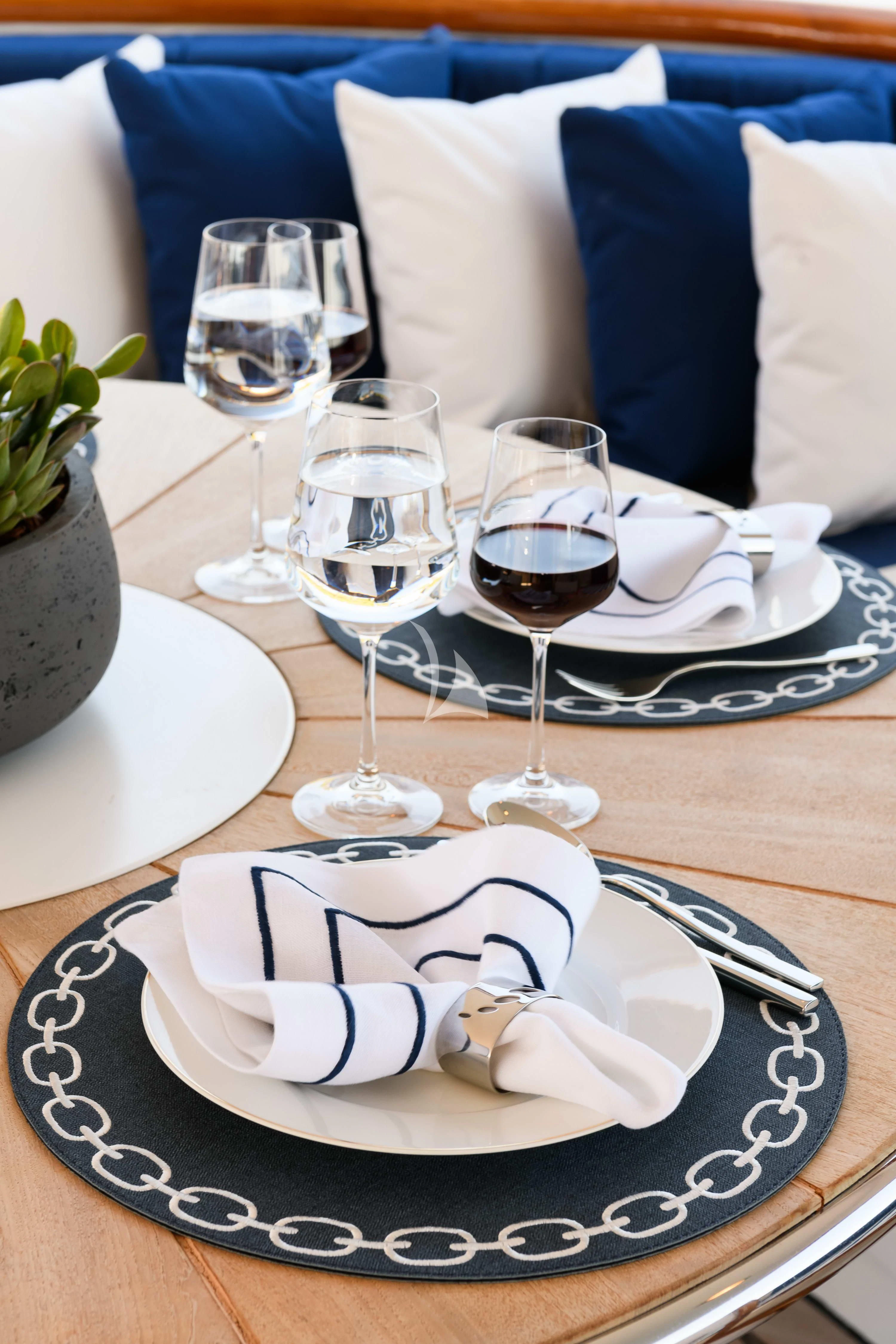 a plate with a cake on it aboard WIND OF FORTUNE Yacht for Charter