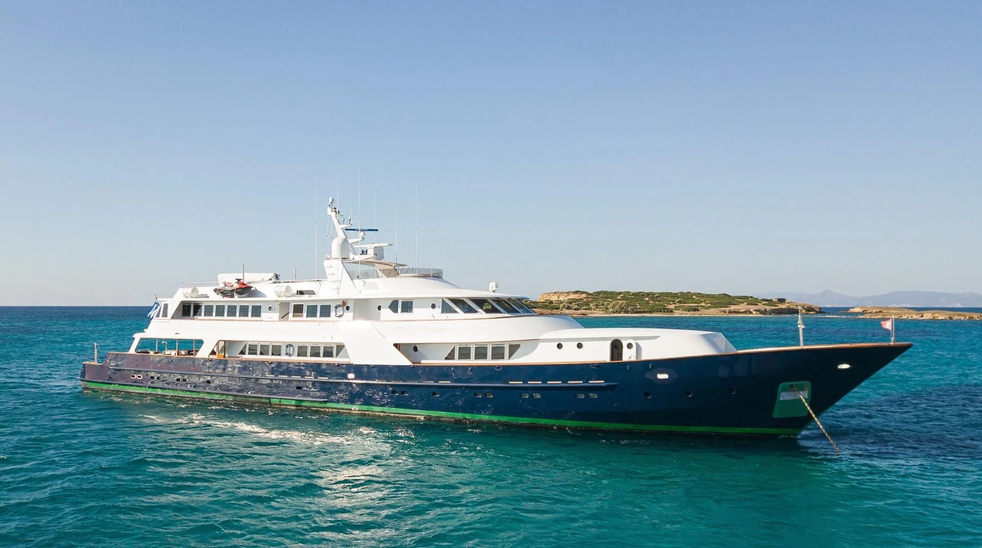 a large boat in the water aboard WIND OF FORTUNE Yacht for Charter