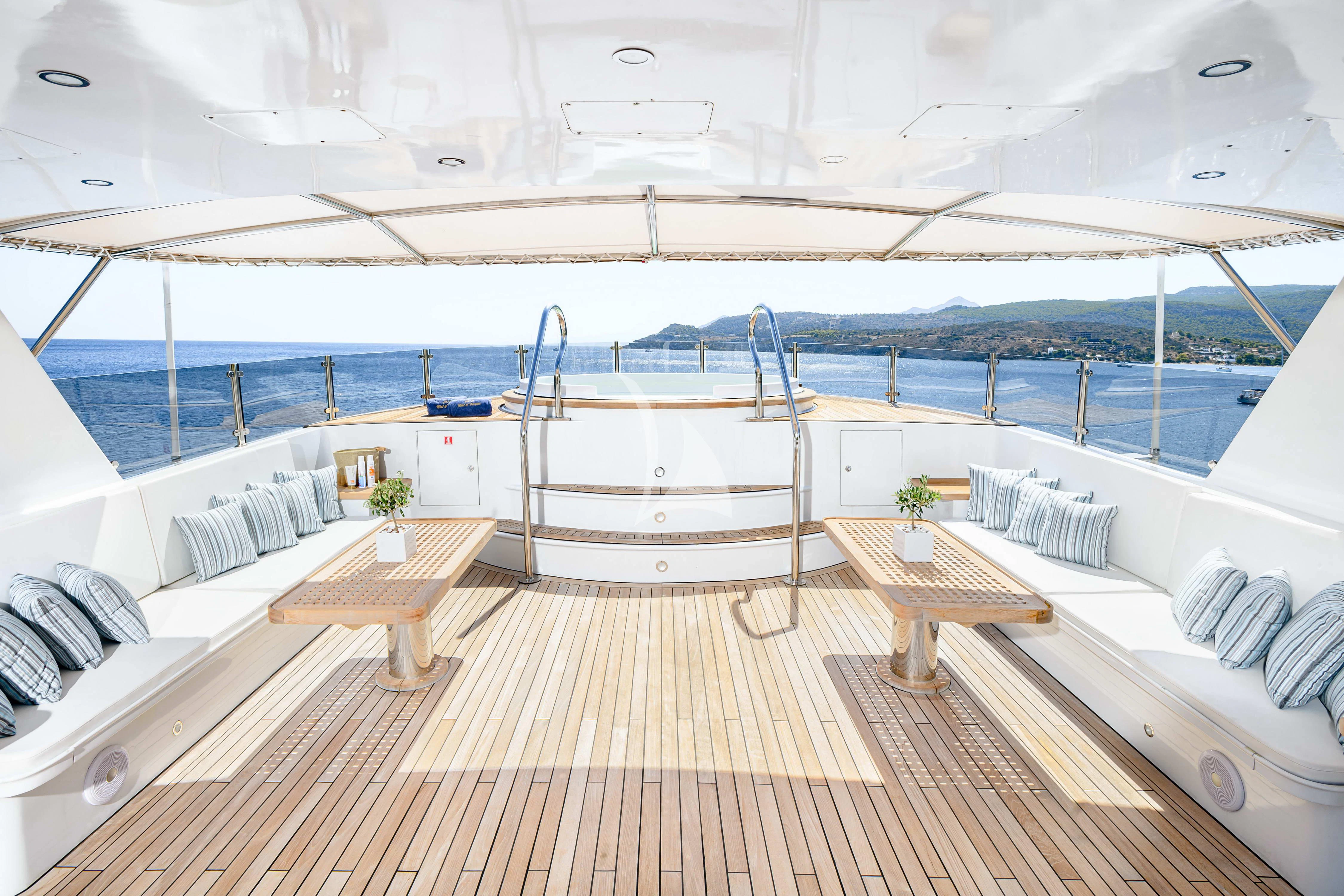 a deck with a large pool aboard WIND OF FORTUNE Yacht for Charter