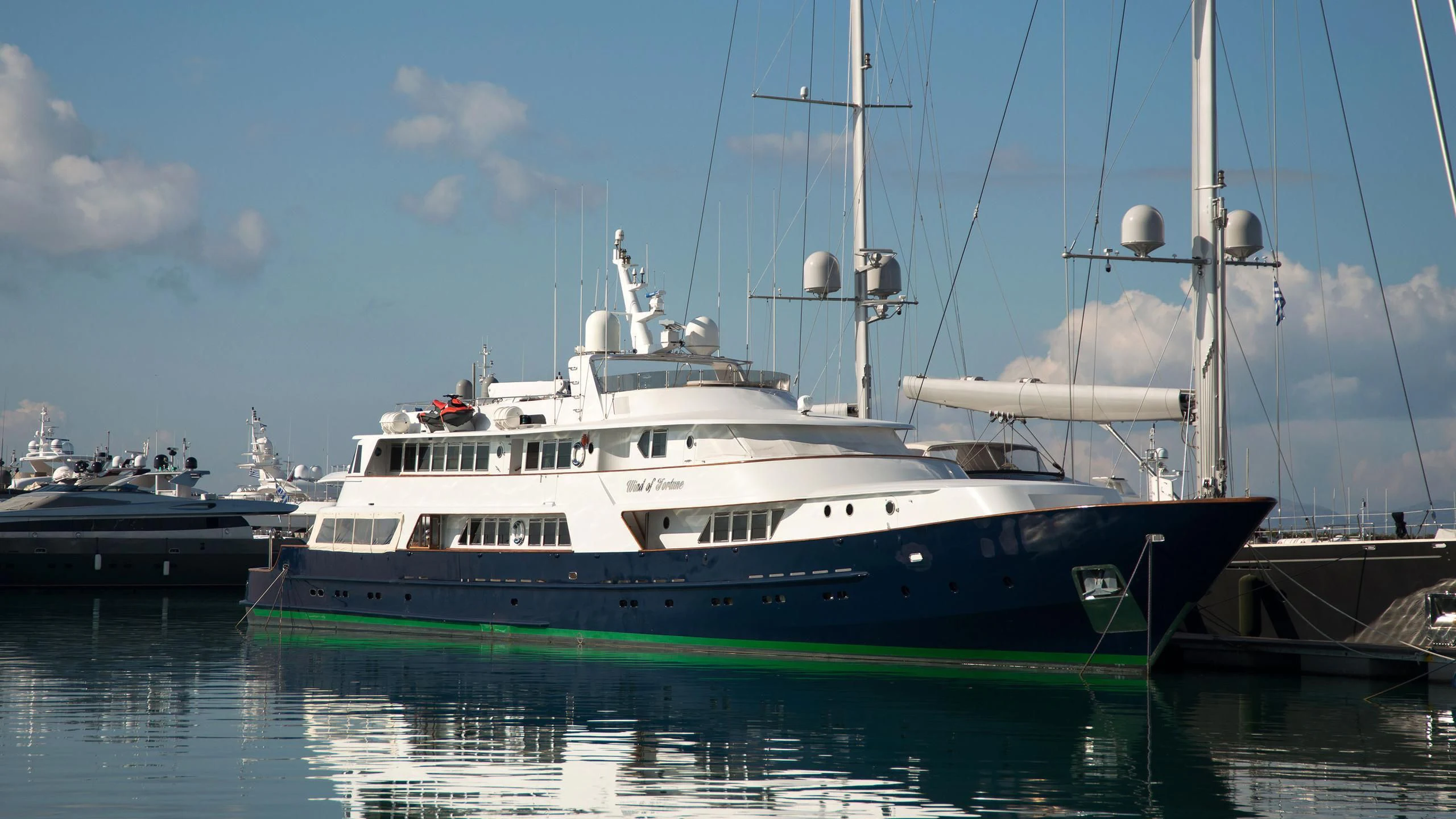 a large boat in the water aboard WIND OF FORTUNE Yacht for Charter