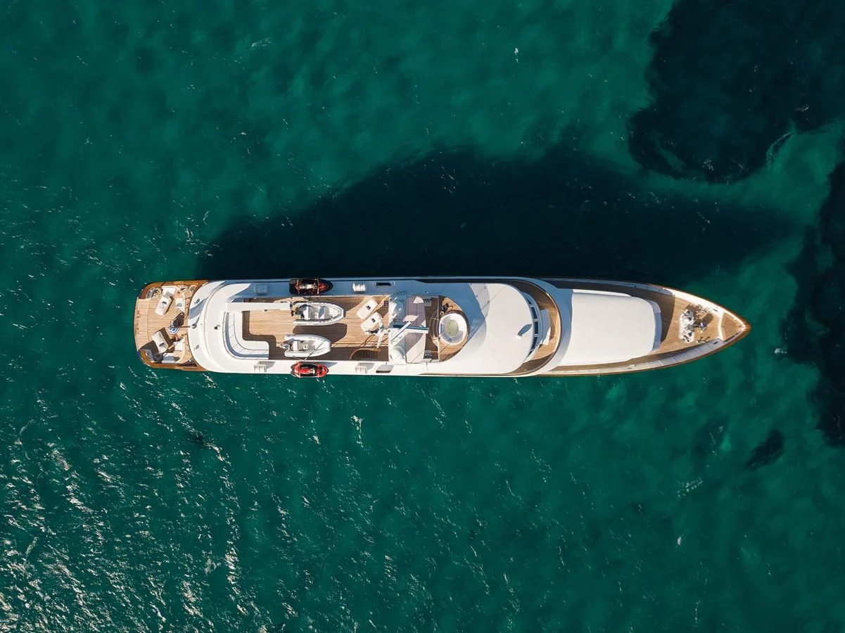 a guitar on a green surface aboard WIND OF FORTUNE Yacht for Charter