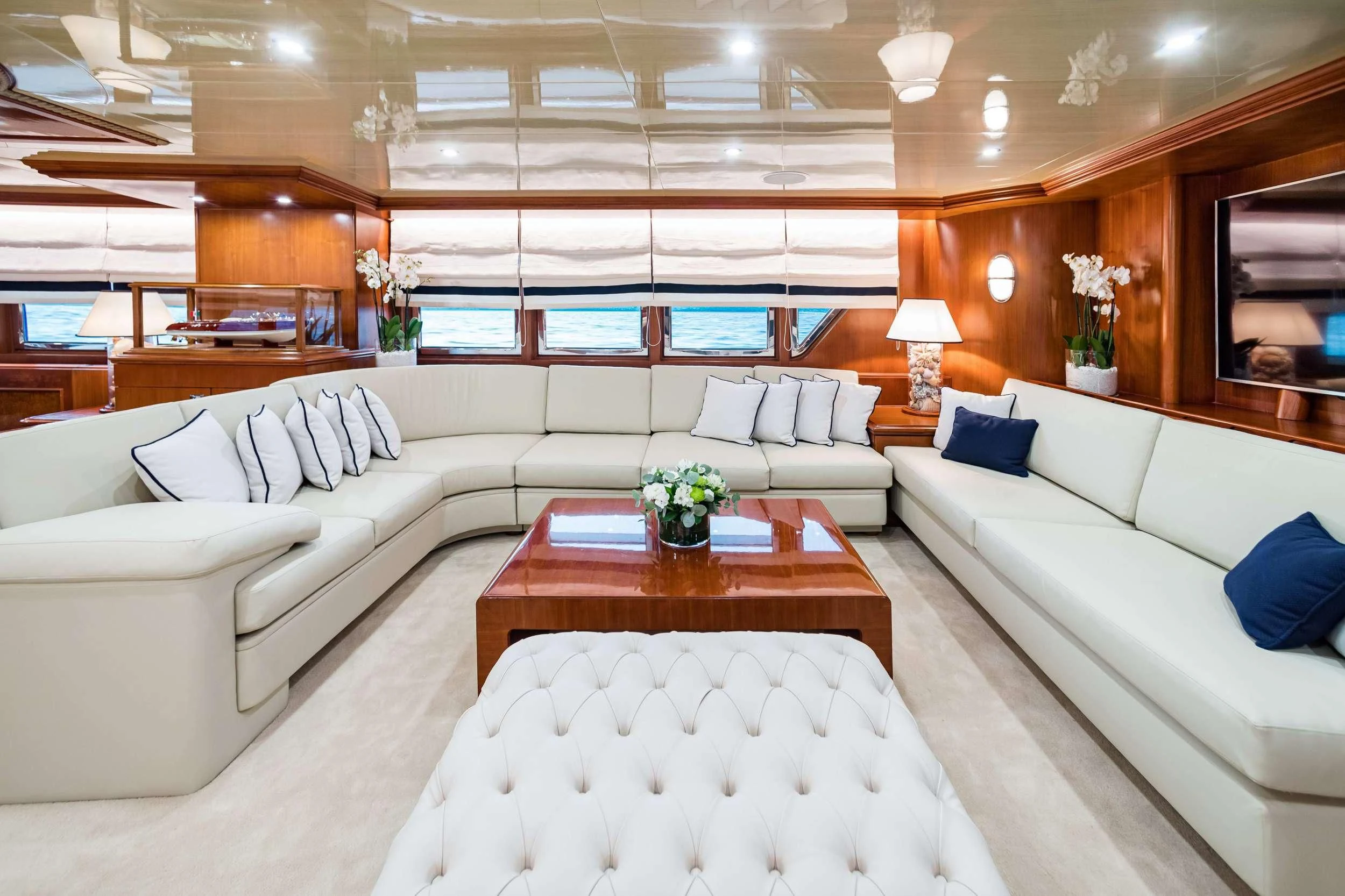 a living room with a couch and a table aboard WIND OF FORTUNE Yacht for Charter