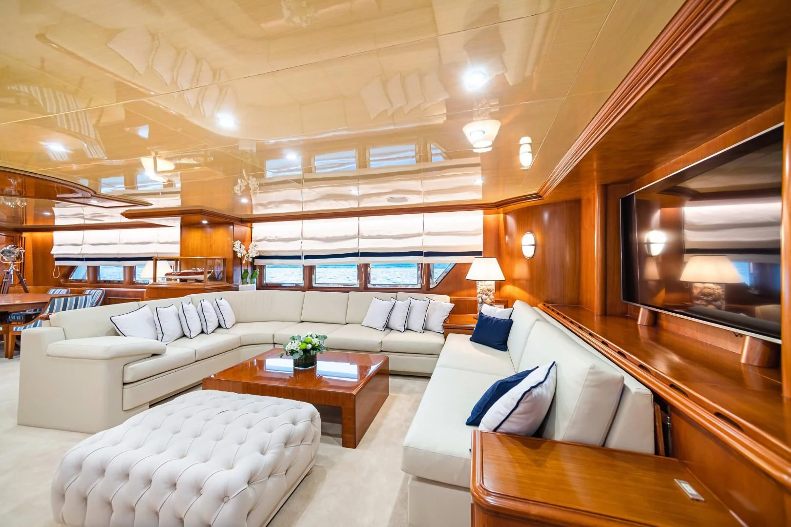 a living room with a large window aboard WIND OF FORTUNE Yacht for Charter