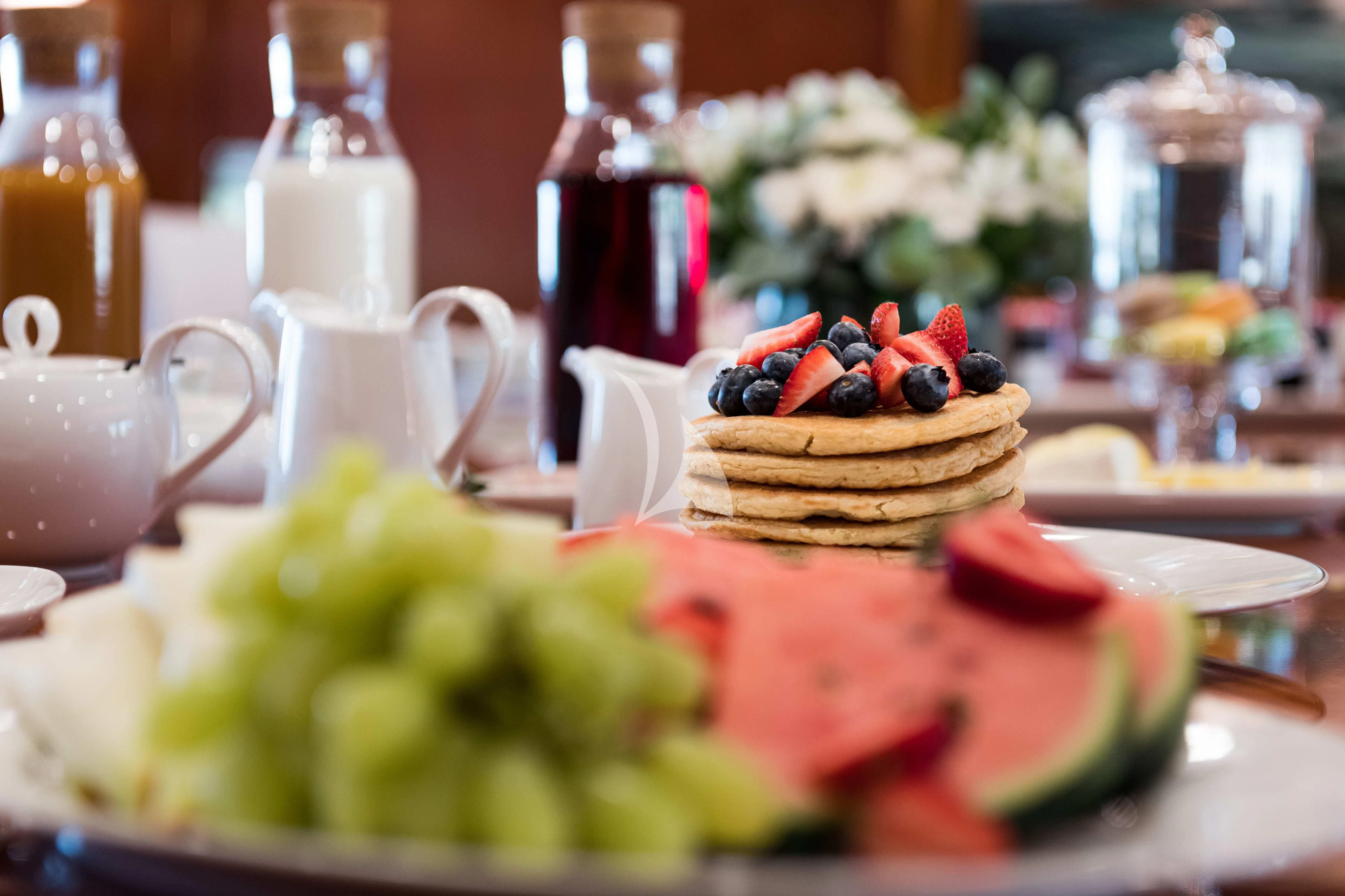 a cake on a table aboard WIND OF FORTUNE Yacht for Charter